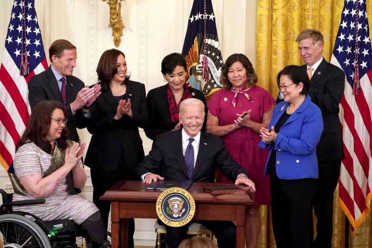 Image: President Joe Biden prepares to sign the COVID-19 Hate Crimes Act into law during a ceremony in the East Room at the White House on May 20, 2021.