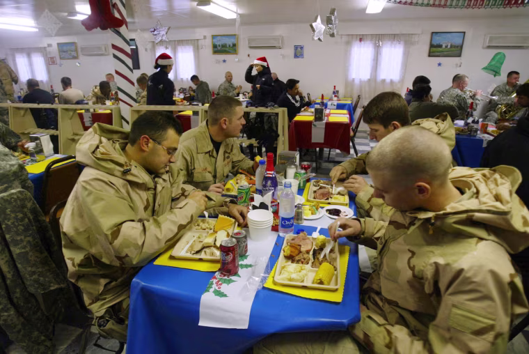 Image: U.S. soldiers enjoy Christmas lunch at a military base in the coalition headquarters in Bagram, north of Kabul, Afghanistan