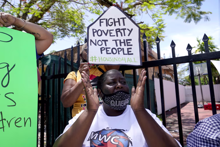 Devetria Stratford chants slogans at a rally held in support of tenant Elena Riech, who is at risk for eviction, on June 8 in Miami.