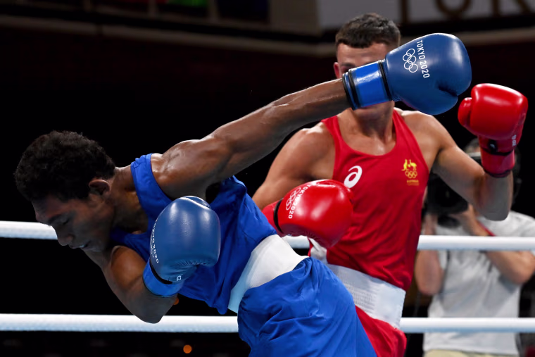 Australia's Harry Garside in action against Papua New Guinea's John Ume in the Men's Lightweight division at Kokugikan Arena in Tokyo on July 25, 2021.