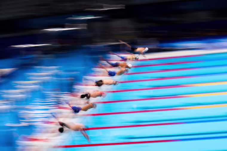 Competitors start during the Men's 100m Breaststroke Semifinal on day two of the Tokyo Games on July 25, 2021.