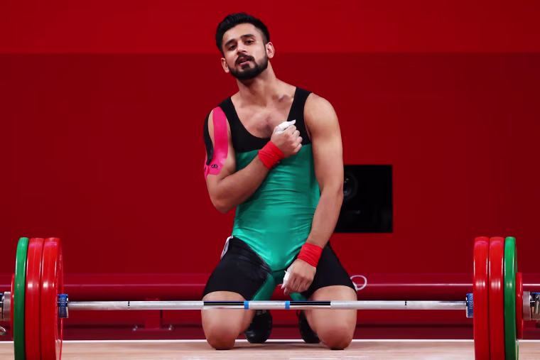 Talha Talib of Pakistan celebrates after a lift at the Olympics in Tokyo on July 25, 2021.