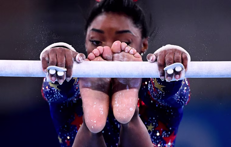 Simone Biles competes on the uneven bars at the Tokyo Games on July 25, 2021.