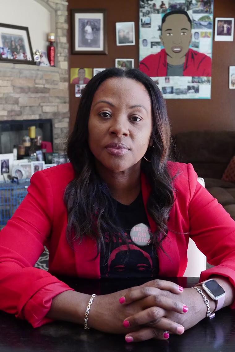 Charmaine Lawson sits in her living room in Perris, California.