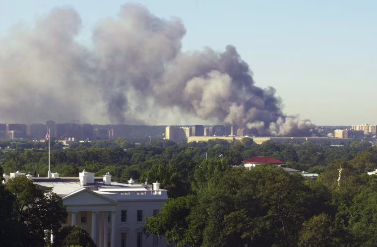 With the White House in the foreground, the Pentagon burns on Sept. 11, 2001, after an airplane crashed into the U.S. military headquarters.