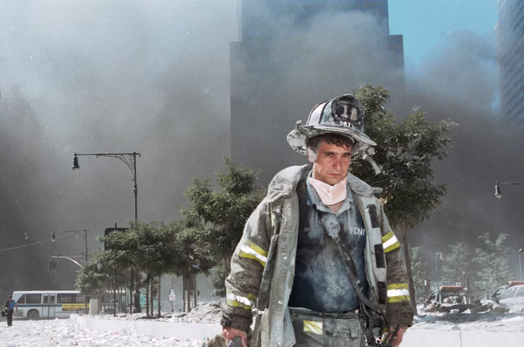 A New York City firefighter walks away from ground zero after the collapse of the World Trade Center towers on Sept. 11, 2001 in New York.