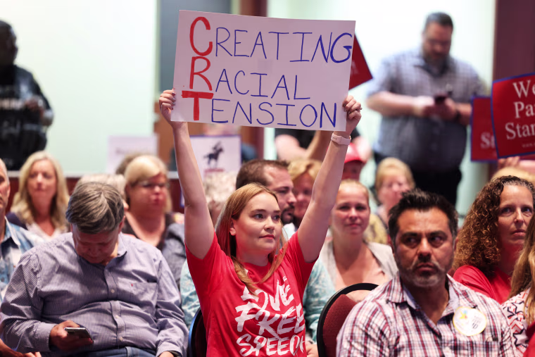 Opponents of critical race theory attend a packed Loudoun County School board meeting until the meeting erupted into chaos and two people were detained in Ashburn, Va., on June 22, 2021.