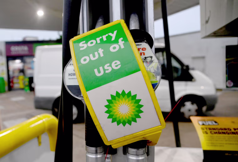 Image: Out of use signs are placed over pumps at a Shell petrol station in London
