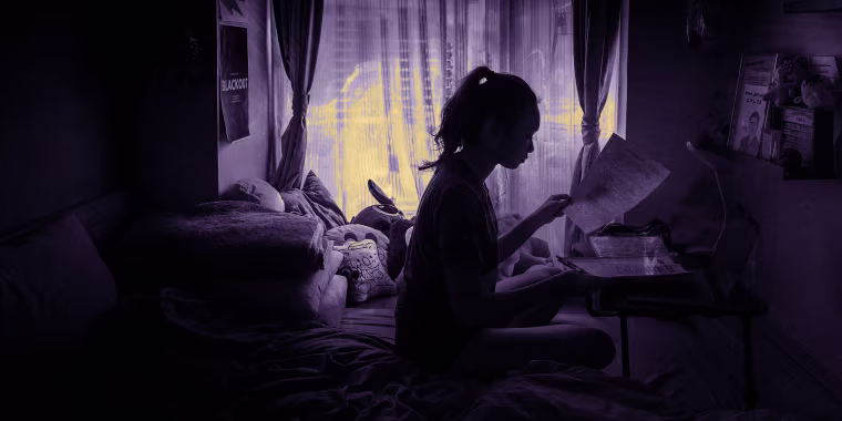 Image: Chloe Lau, a high school student in Hong Kong, does her schoolwork at home on March 4, 2020.