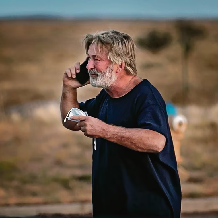 Image: Alec Baldwin takes a call in the parking lot outside the Santa Fe County Sheriff's offices after being questioned on the shooting.