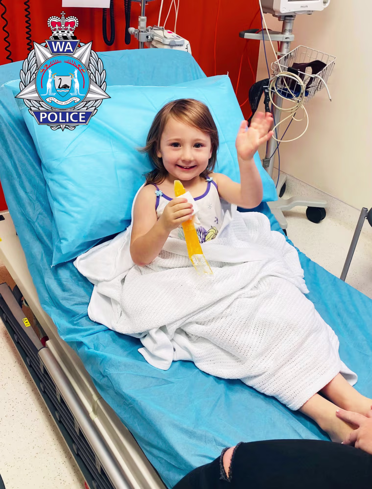 Image: Cleo Smith waves from a hospital after being found.