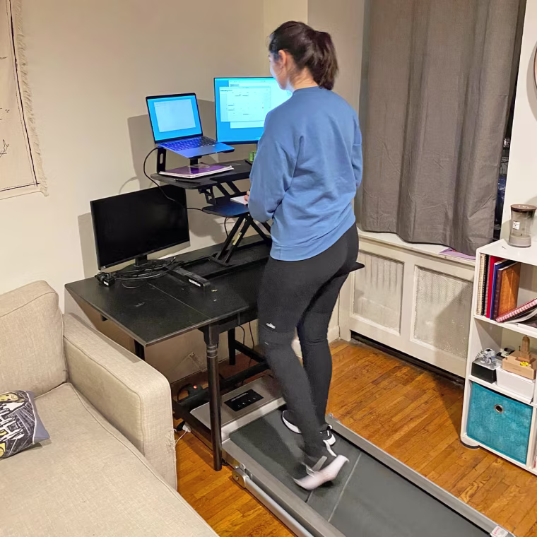 Senior commerce editor Alexandra Deabler using the Doufit electric foldable treadmill