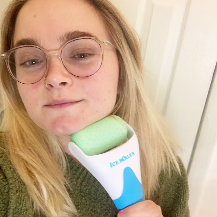 Associate editor Emma Stessman using the Esarora Ice Roller