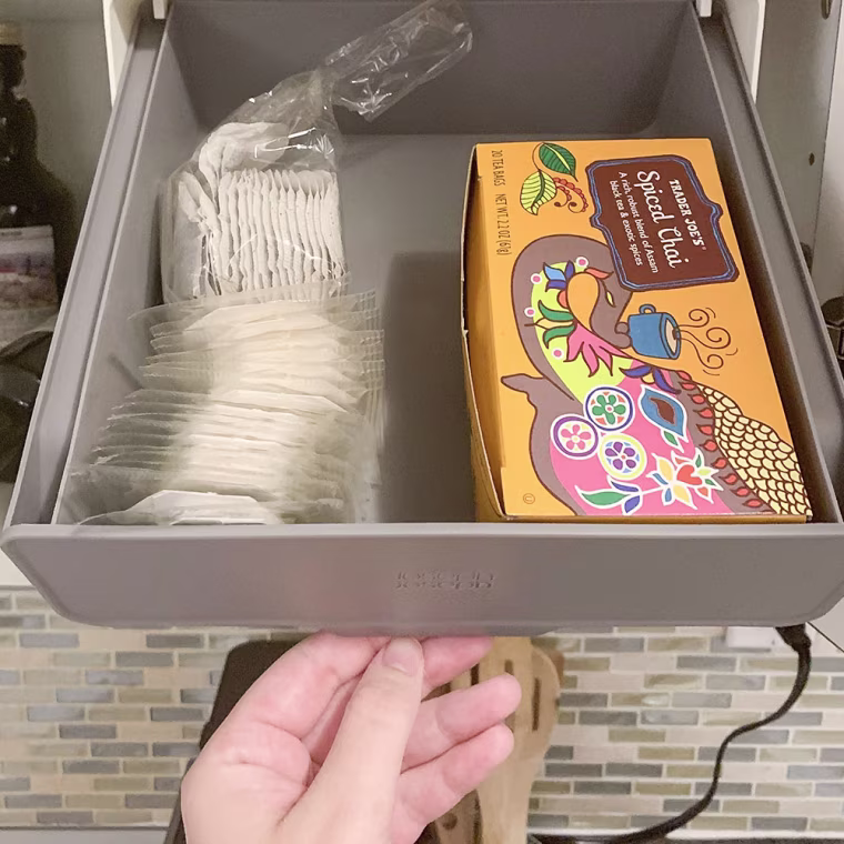 Image of a hand opening the CupboardStore Under-shelf drawer