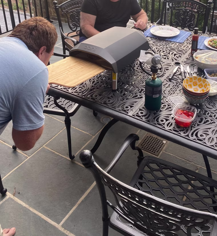 Select editor Christina Colizza's younger brother inspects his pizza in the Ooni Koda.