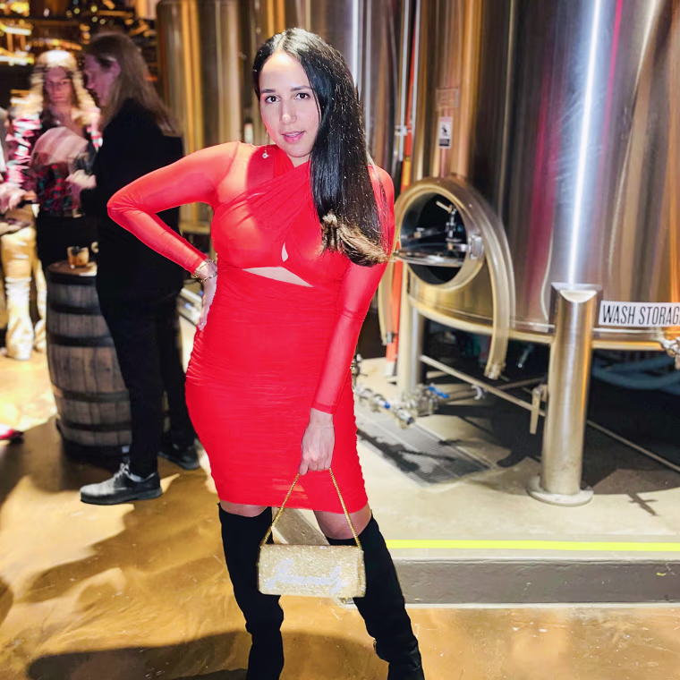 Jannely Espinal in a red dress