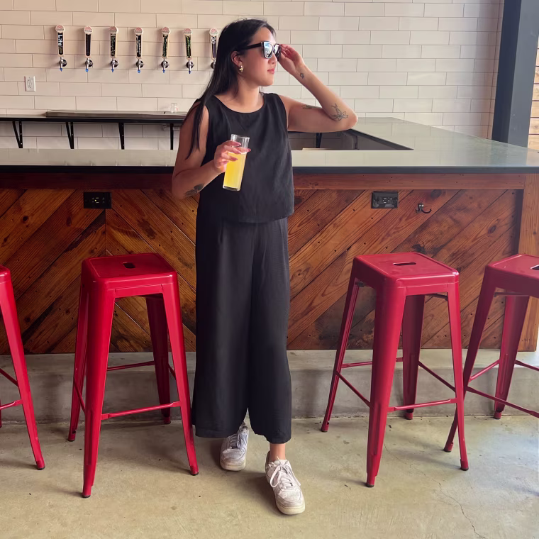 Woman wearing a black Amazon two-piece set while at a bar