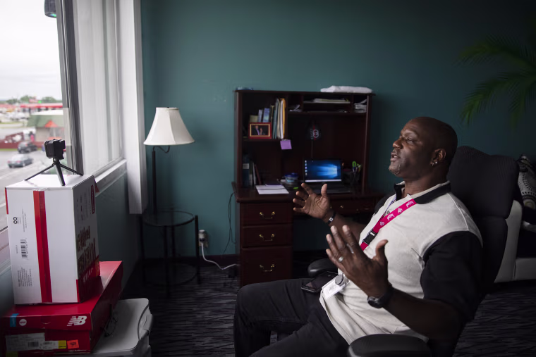 Image: Reid records a video in his work space in Austintown, Ohio, on July 17, 2021.