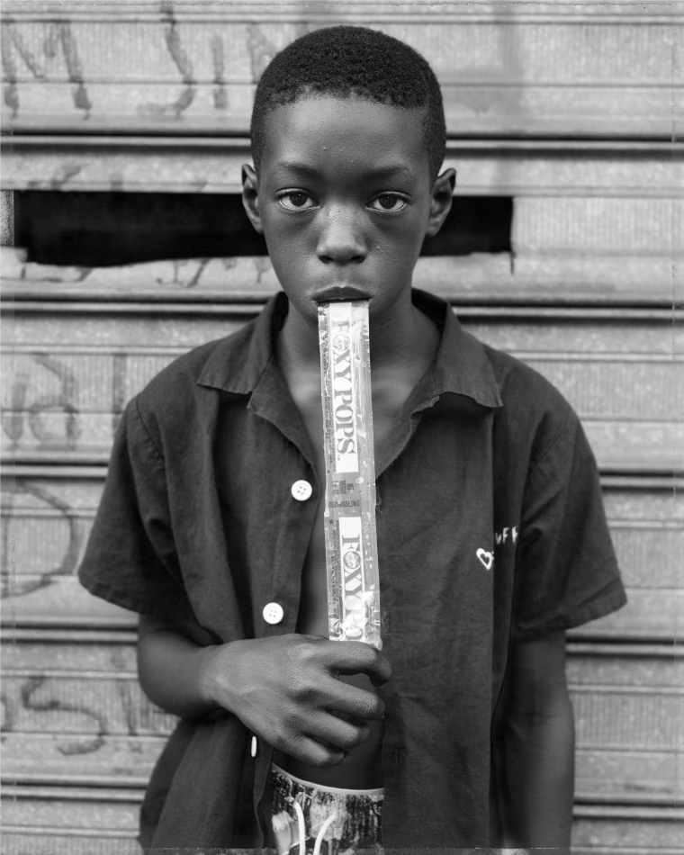 A boy eating a Foxy Pop in Brooklyn, N.Y., in 1988.