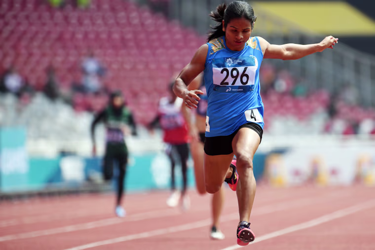 Dutee Chand wins a heat of the women's 200-meter dash during the 2018 Asian Games in Jakarta, Indonesia, on Aug. 28, 2018.