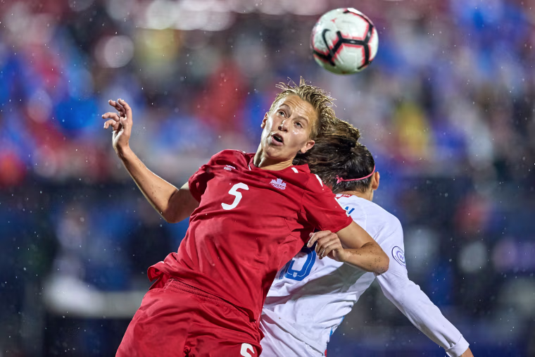Image: Rebecca Quinn battles for the ball during the final match of the CONCACAF Women's Championship between USA and Canada on Oct. 17, 2018 in Frisco, Texas.
