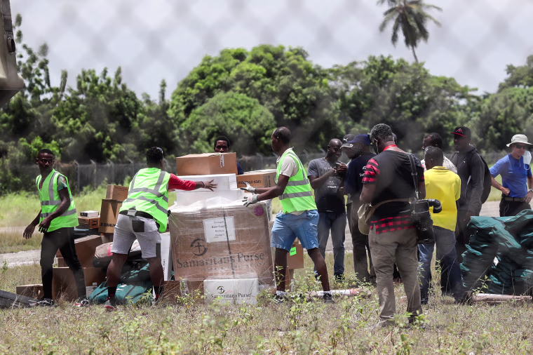 Image: Workers unload humanitarian aid from a U.S. helicopter at Les Cayes airport in Haiti, Aug. 18, 2021.