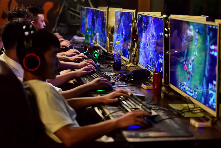 People play online games at an internet cafe in Fuyang, Anhui province, China on Aug. 20, 2018.
