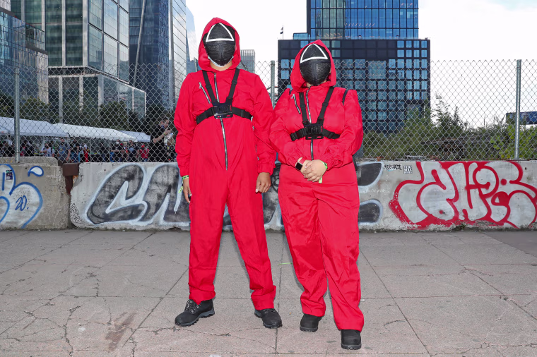 Cosplayers attend New York Comic Con as Squid Game characters on Oct. 8, 2021.
