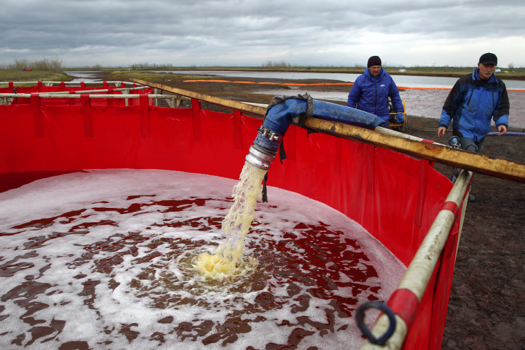 Image: Employees of Russia's state-owned oil pipeline monopoly Transneft during a clean-up operation following a massive fuel spill in the Ambarnaya River outside Norilsk on June 10, 2020.