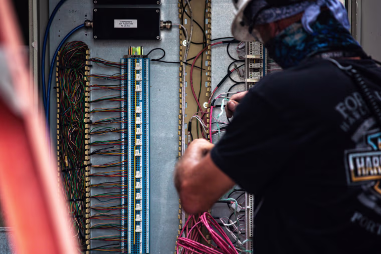 An employee of Vistra Corp.’s Midlothian Power Plant in Midlothian, Texas, adjusts the wiring of a power unit on Oct. 15, 2021. Energy providers like Vistra are preparing their plants for extreme weather conditions following the February winter storm Uri, which disrupted the Texas electric grid and led to the deaths of more than 200 people.