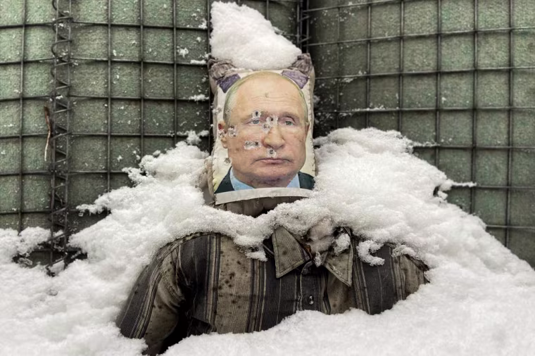 A likeness of Russian President Vladimir Putin is riddled with bullet holes at an army base in Zolote, Ukraine, on Feb. 1, 2022.