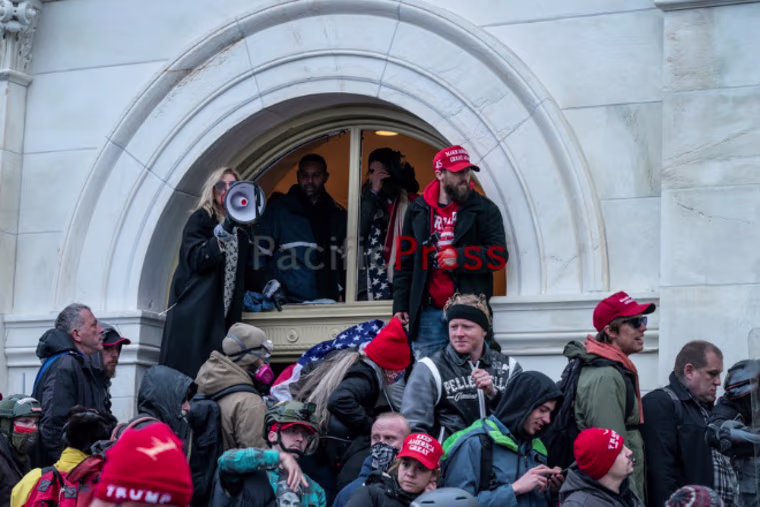 Gina Bisignano, video shows, was amongst the first group of rioters to enter the tunnel on the west side of the Capitol on Jan. 6, 2021.