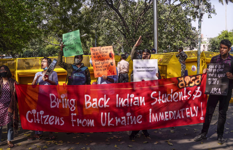 Image: Activist of All India Students' Association shout slogans during protest in New Delhi on March 2, 2022.