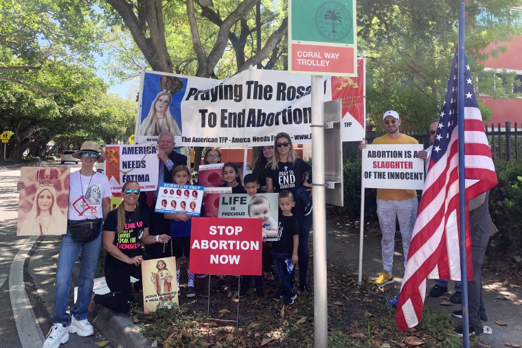 Religious groups and members of the Venezuelan American Republican Alliance protest outside an abortion clinic in Miami.