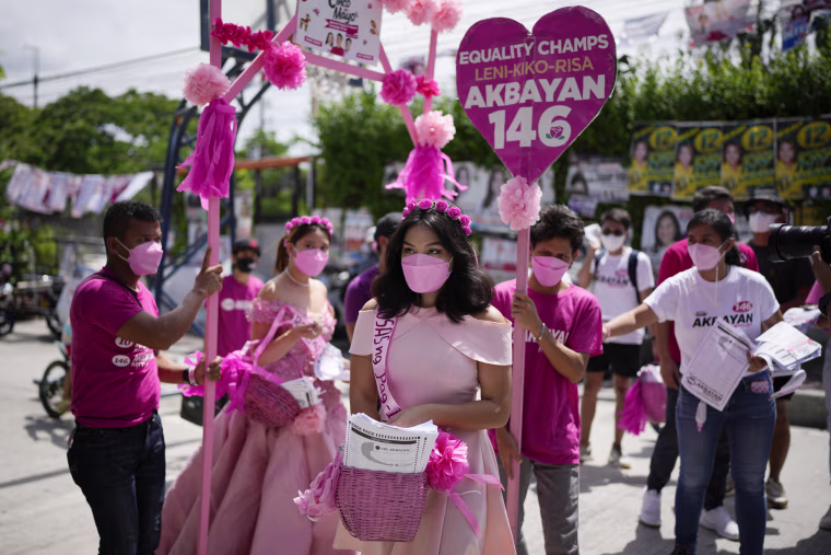 Volunteers in pink gowns campaigning for presidential candidate Leni Robredo in Quezon City, the Philippines, on Thursday. 
