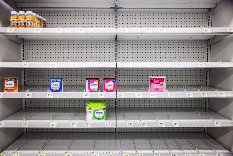 Image: Shelves normally meant for baby formula sit nearly empty at a store in downtown Washington, DC, on May 22, 2022.