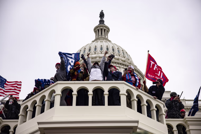 Image: Pro-Trump supporters on the steps of the Capitol in Washington following a rally with President Donald Trump on Jan. 6, 2021.