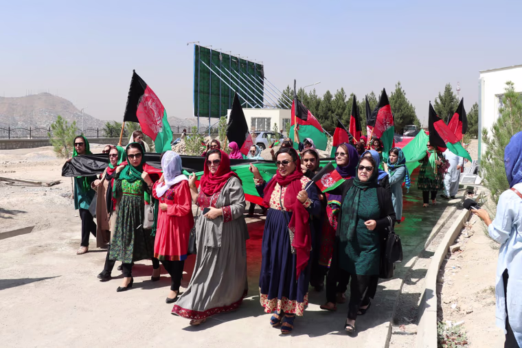 Roshan Mashal, center, leading a march for women’s rights in Afghanistan before the U.S. withdrawal from the country.
