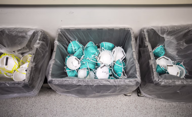 Used N95 masks are collected at Massachusetts General Hospital in Boston on April 13, 2020. Hospital staff wrote their names on their old masks so each can be returned to their original user to ensure the best fit.