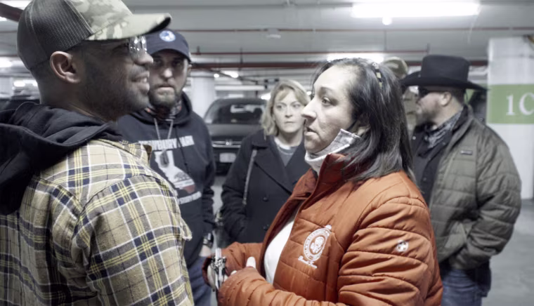 Image: Kellye SoRelle, back center, at a Jan. 5 meeting with Enrique Tarrio of the Proud Boys and Stewart Rhodes of the Oath Keepers.