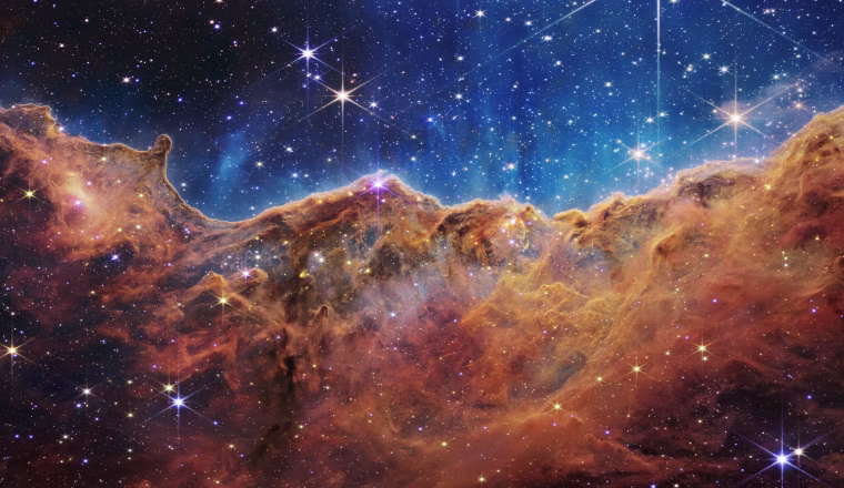 The Webb telescope's view of the Carina Nebula reveals previously invisible areas of star birth.