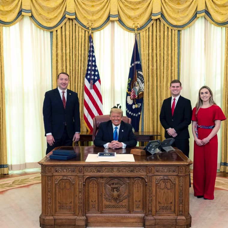 Image: Garrett Ziegler, second right, at the White House with Donald Trump.