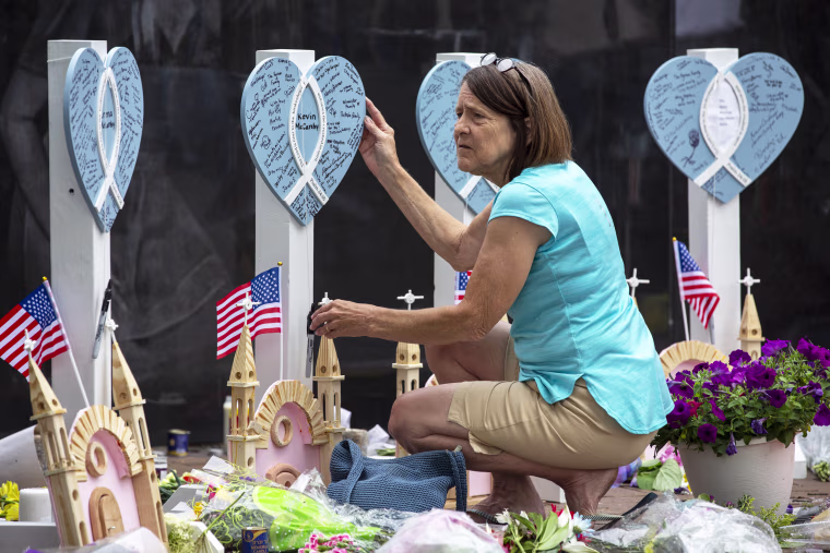 a memorial for the victims of a mass shooting at 4th of July parade in Highland Park