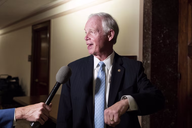 Sen. Ron Johnson speaks to a reporter outside of the Senate Homeland Security hearing room on Aug. 3, 2022.