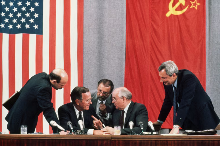 U.S. President George Bush and Soviet leader Mikhail Gorbachev laugh together during the 1991 Moscow Summit.