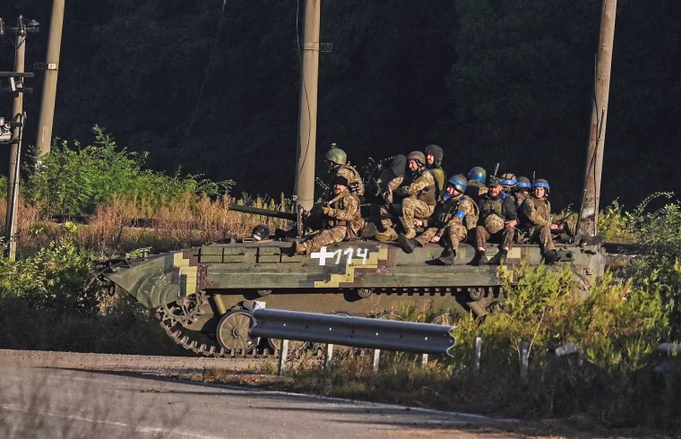 Ukrainian soldiers on an armored vehicle in Kharkiv, Ukraine, on Sept. 9, 2022.