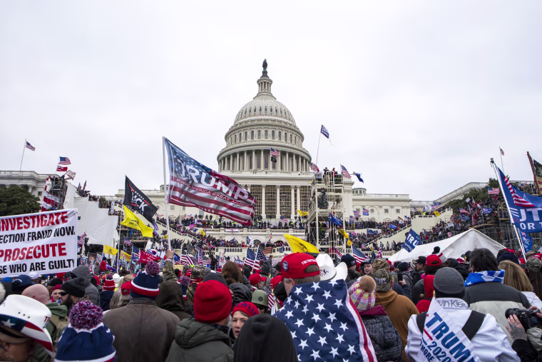 Supporters of then-President Donald Trump breach the Capitol