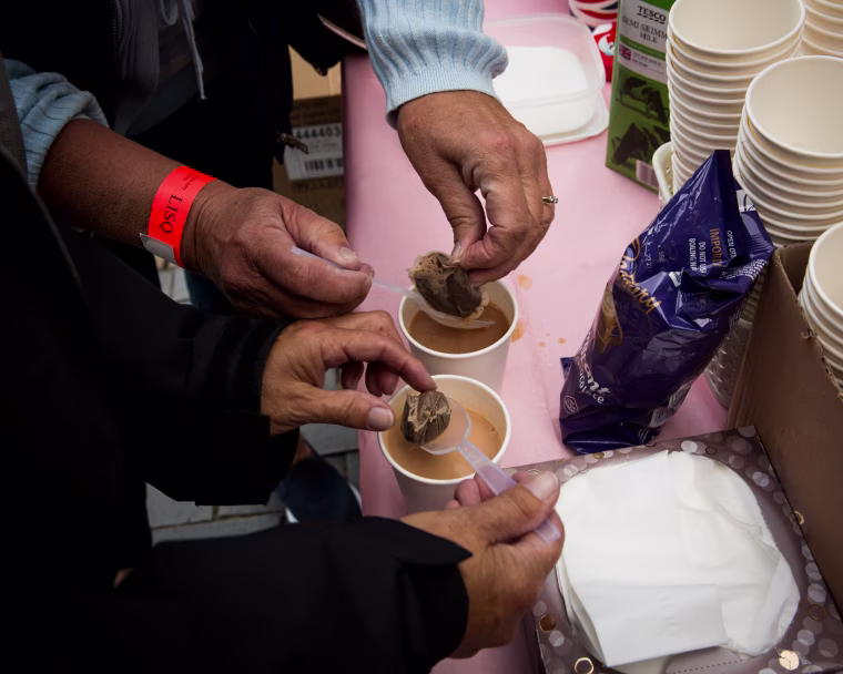 Image: Joe's tea stand in Rotherhite serves people waiting in line.