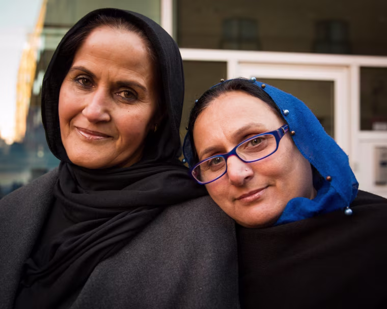 Image: Jabin Naz, 48, left, and Shahida Batool, 53, have been waiting an hour and a half, and are about 4.5 miles from the Palace.