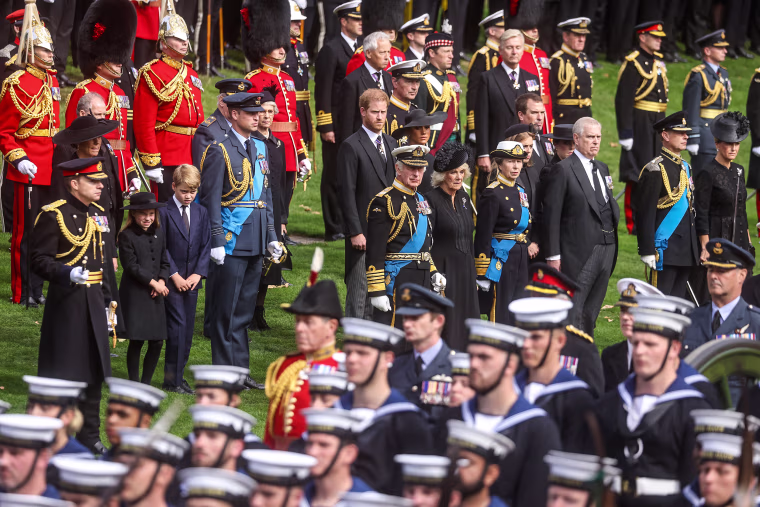 The royal family watch as the hearse carrying the coffin of Queen Elizabeth II prepares to depart from near Wellington Arch, on its way to Windsor, in London, on Sept. 19, 2022.